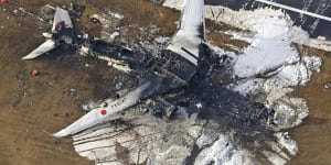 The burnt out Japan Airlines plane that collided with another aircraft on Tuesday evening. All 379 passengers and crew safely evacuated,though five people on board the other plane were killed.