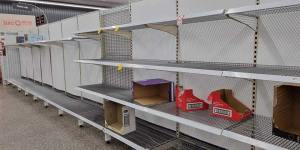 Bare shelves at a Coles supermarket in Brisbane.