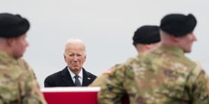 President Joe Biden stands as an Army carry team moves the transfer case containing the remains of US Army Sergeant Breonna Alexsondria Moffett,one of three killed in the attack in Jordan. 