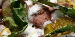 Beef heart with mustard leaves,white sauce and pickles.