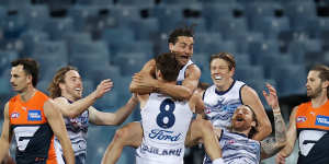 Jake Kolodjashnij celebrates after kicking a goal.