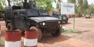 A Malian police officer stationed on an armoured personnel vehicle outside Campement Kangaba,Bamako.