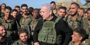 Israeli Prime Minister Benjamin Netanyahu meets with soldiers stationed near the Gaza Strip in Jerusalem.