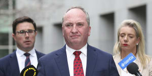 Deputy Prime Minister Barnaby Joyce,flanked by David Littleproud and Bridget McKenzie,after winning the Nationals party room ballot to return to the leadership.