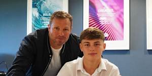 Marcus Neill with his father,Lucas,as he signed a scholarship deal with Sunderland.