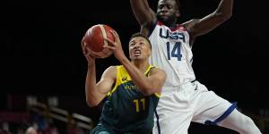 Dante Exum goes to the basket at the Tokyo Olympics.