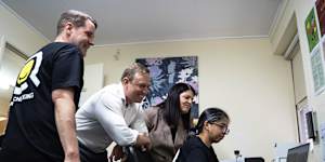 Then-premier Steven Miles and MP Grace Grace (both centre) inspecting a Bowen Hills pill-testing site ahead of its launch in 2024.