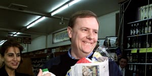Peter Costello buys groceries on the first day of the GST on July 1,2000. 