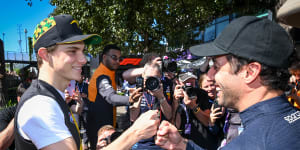 Oscar Piastri and Daniel Ricciardo say g’day in front of the media pack.