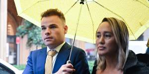 Taylor Auerbach leaves Federal Court with his lawyer Rebekah Giles after giving evidence in the Bruce Lehrmann defamation case in Sydney on Friday.