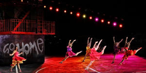 The high-octane choreography requires explosive theatrical energy.