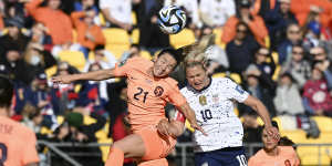 Netherlands’ Damaris Egurrola,left,and United States’ Lindsey Horan compete to head the ball.