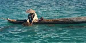 Nikodemus Manefa collects seaweed off the east coast of Rote island last month.