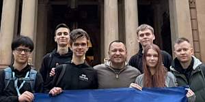 Australia’s ambassador to Ukraine,Vasyl Myroshnychenko,pictured with the Ukrainian teenager competiting at the International Cyber Olympiad in AI in Sydney.