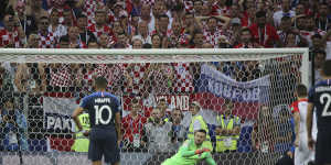 Antoine Griezmann's penalty beats Croatia's keeper Danijel Subasic.