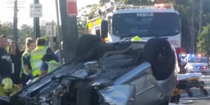 Bystanders free driver from overturned car after serious crash