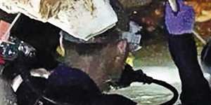 Ahead of the daring rescue,a team of divers brings supplies and food into the cave for the boys and their coach.