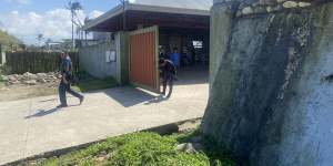Security personnel at the entrance of the Degamo family compound this week.