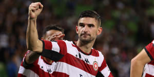 Steven Ugarkovic celebrates scoring a penalty for the Wanderers against Melbourne Victory at AAMI Park on Sunday night.
