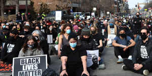 Demonstrators sit for a moment of silence during a protest in Minneapolis,Minnesota,US. 