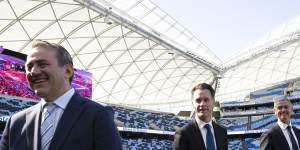 NSW Premier Chris Minns with ministers Steve Kamper,left,and John Graham,right,at Allianz Stadium