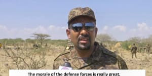 Ethiopian PM Abiy Ahmed,dressed in military uniform,speaks to a television camera at an unidentified location.
