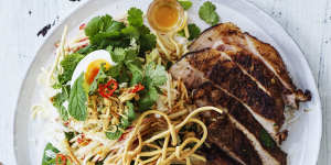 Spiced pork chops with boiled eggs,crispy noodles and slaw.