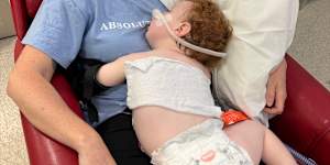Doctors say 14-month-old Gold Coast toddler Dustin Wildman is slowly improving after accidentally ingesting metallic rose gold dust powder,but have warned he could suffer “lifelong issues”.