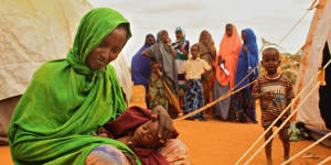 Ladhan Waraq with her daughter Sahlan Mohammed on the outskirts of Dadaab refugee camp in Kenya,near the Somalian border,in 2011.
