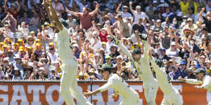 The Australian team celebrates retaining the Ashes in the 2021 Boxing Day Test.