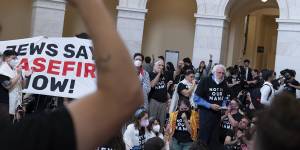 Demonstrators protest inside the Cannon House Office Building on Capitol Hill in Washington on Wednesday.