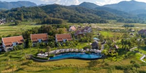 The semi-detached villas at the Pullman Luang Prabang,in Laos,are spread among working rice paddies.