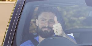 Chelsea's Olivier Giroud gives the thumbs-up as he left the club training centre this week.