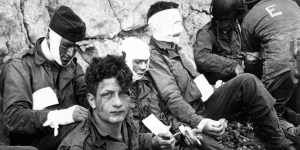American assault troops of the 16th Infantry Regiment,injured while storming Omaha Beach,wait for evacuation to a field hospital in this photo taken at Colleville-sur-Mer,Normandy,France,on June 6,1944. 