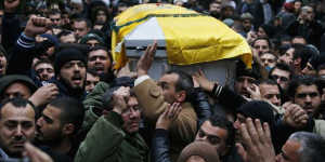 Outrage:Lebanon's Hezbollah members and relatives carry the coffin of Hassan al-Laqqis.