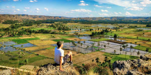 Men aerial view to paddy field at Bukit Persaudaraan Waingapu Sumba Island,East Nusa Tenggara,Indonesia sataug6coverÂ asia major coverÂ story;text byÂ BrianÂ Johnstoncr:Â iStockÂ (reuseÂ permitted,noÂ syndication)Â 