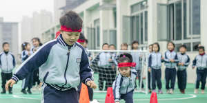 Kindergarten children play football games to celebrate World Football Day (December 10) in Huzhou,China.