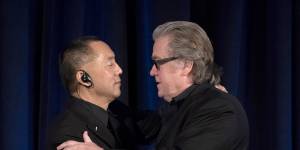 Former White House chief strategist Steve Bannon,right,greets fugitive Chinese billionaire Guo Wengui in New York.