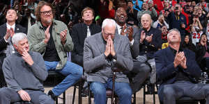 Legendary Bulls coach Phil Jackson takes the applause as Longley looks on.