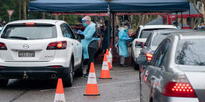 Northern beaches residents queue for COVID-19 testing at the Frenchs Forest Warrningah Aquatic Centre testing site. December 19,2020. SMH SHD NEWS. Photographer has requested no credit please.Â 
