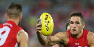 Josh Kennedy grabs possession for the Swans against Collingwood.