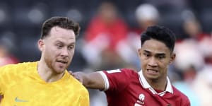 Socceroo Gethin Jones and Indonesia’s Marselino Ferdinan compete for the ball.