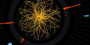 2011 image of a real proton collisions picked up by the LHC detector showing the signature decay of a Higgs boson.