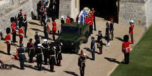 Prince Philip’s coffin is loaded onto the specially modified Land Rover. 