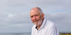 Rex Grady near the barrier erected by the Port Fairy golf club to protect the course from rising seas.