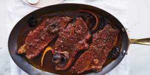 Braised brisket with prunes and bacon. 