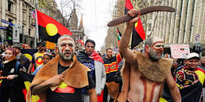 Sovereignty never ceded protesters march along Swanston Street on Saturday.