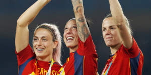 Spain’s Alexia Putellas,Jennifer Hermoso and Irene Paredes,from left,celebrate with the trophy at the end of the Women’s World Cup final.