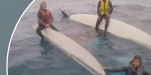 Three people have been rescued after their boat overturned on the NSW South Coast.