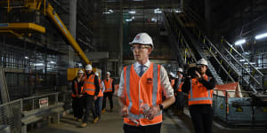 NSW Premier Dominic Perrottet walks through a Metro tunnel beneath Martin Place on Wednesday.